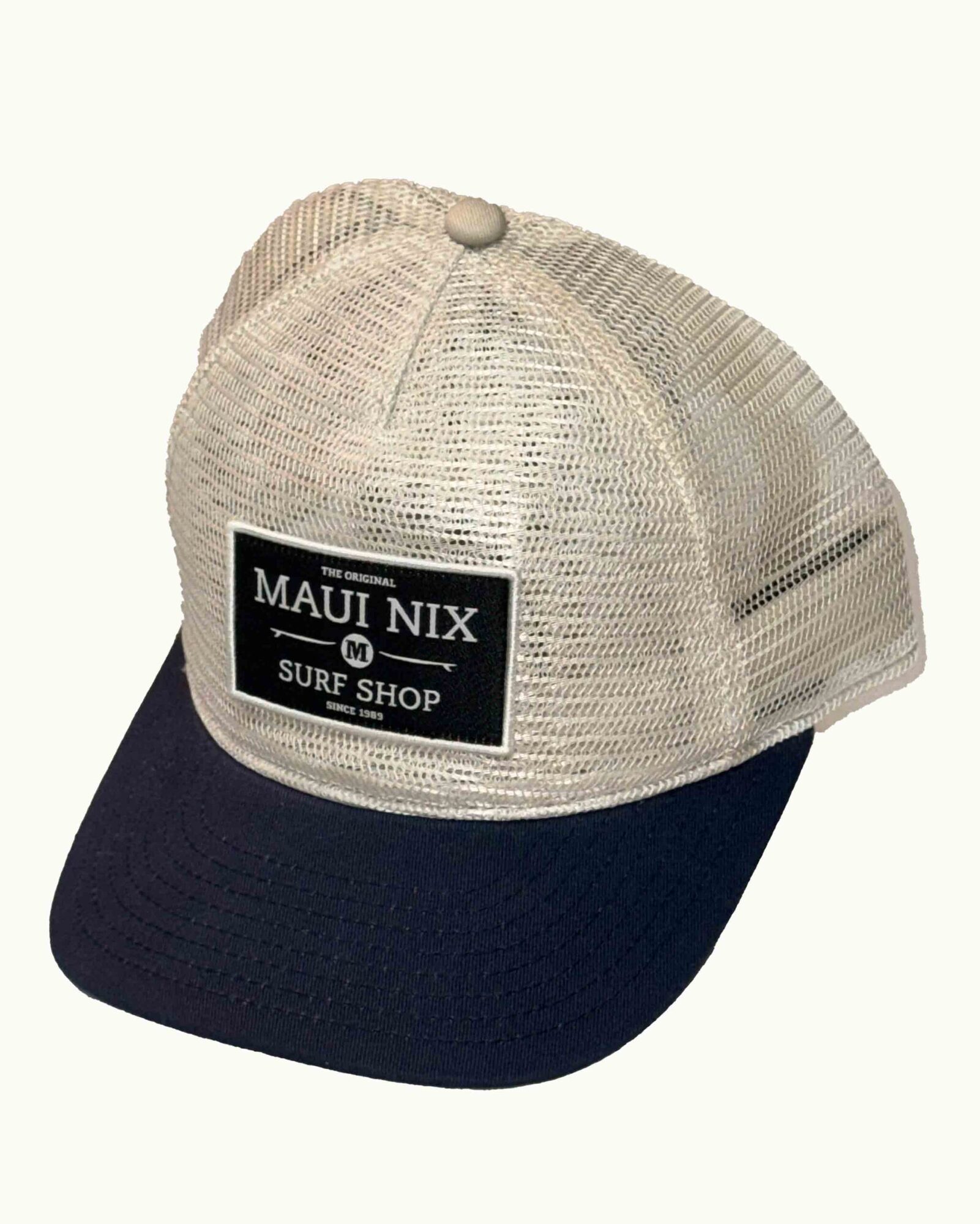 This is an image of Maui Nix Trucker Squarepatch Logo Hat